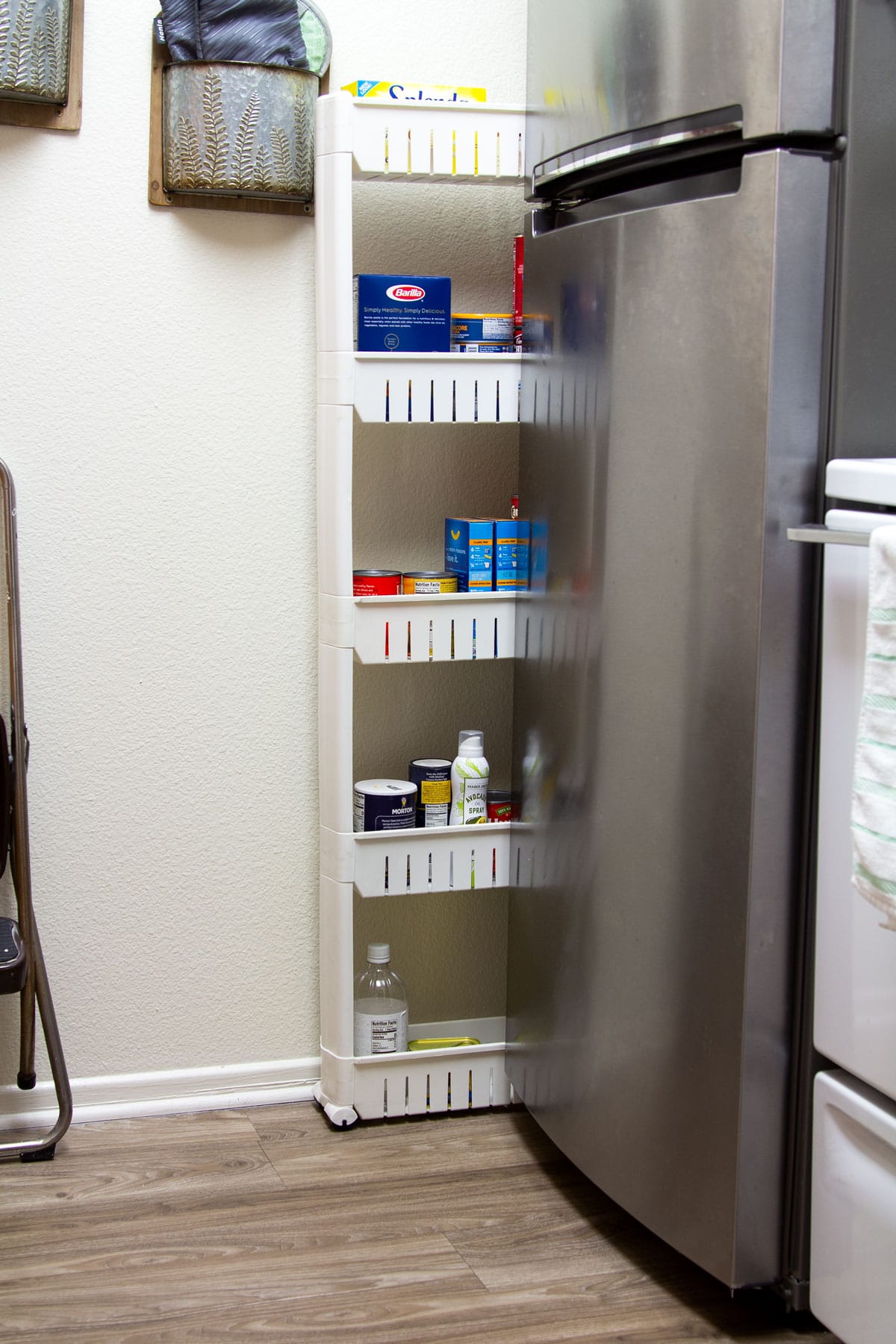 surprising apartment storage ideas slide in pantry next to stainless refrigerator