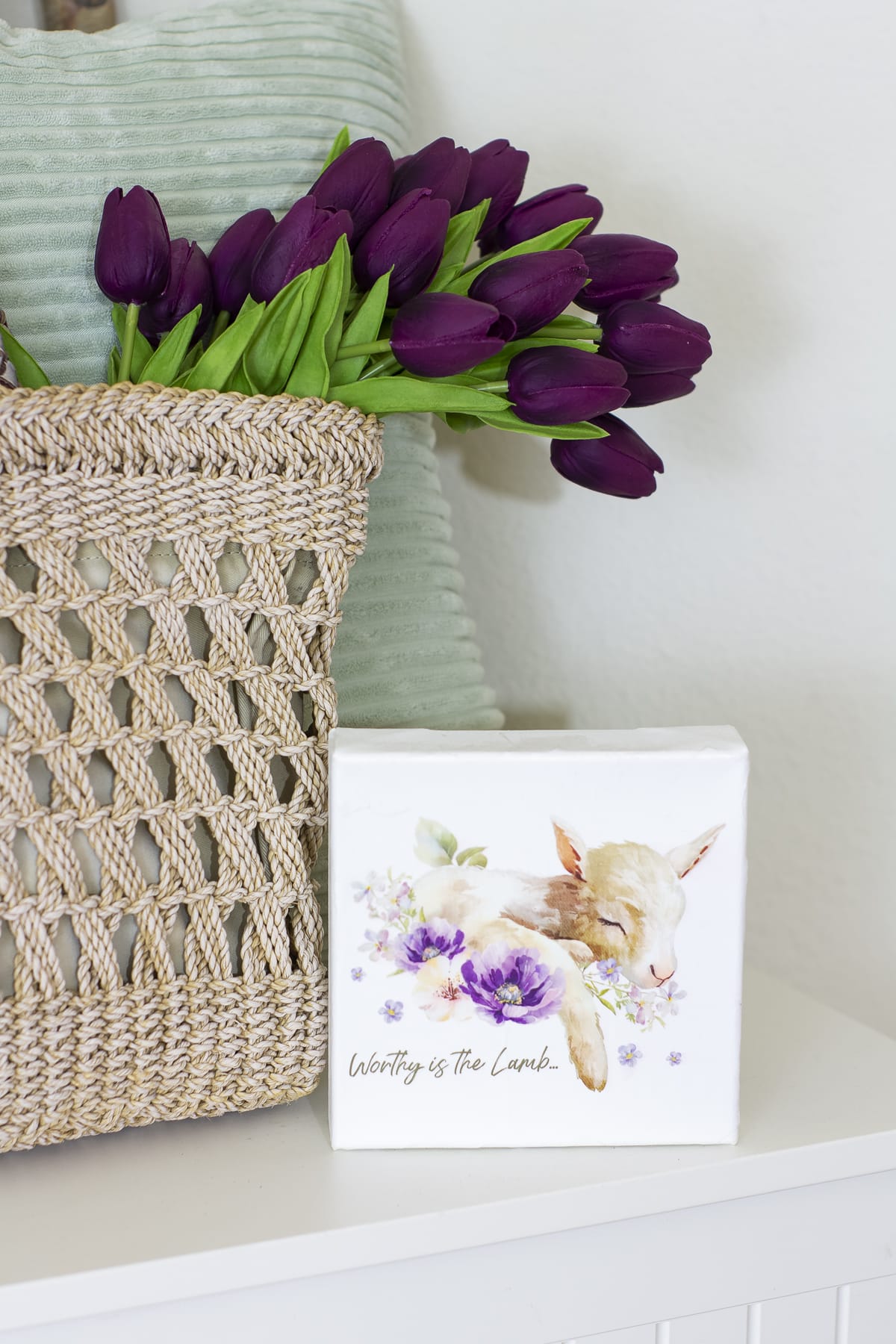 small entryway spring decor pinterest challenge white bench with woven tote and purple tulips with tiny lamb artwork in front of mint pillow