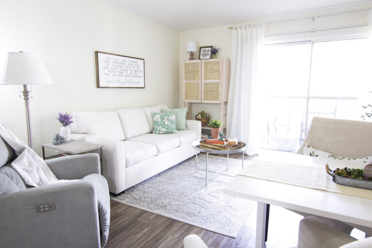 living room with furniture in white and gray and spring decor