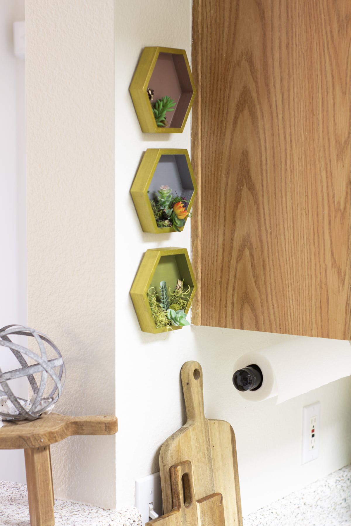 diy painted hexagon shelves with succulents in kitchen