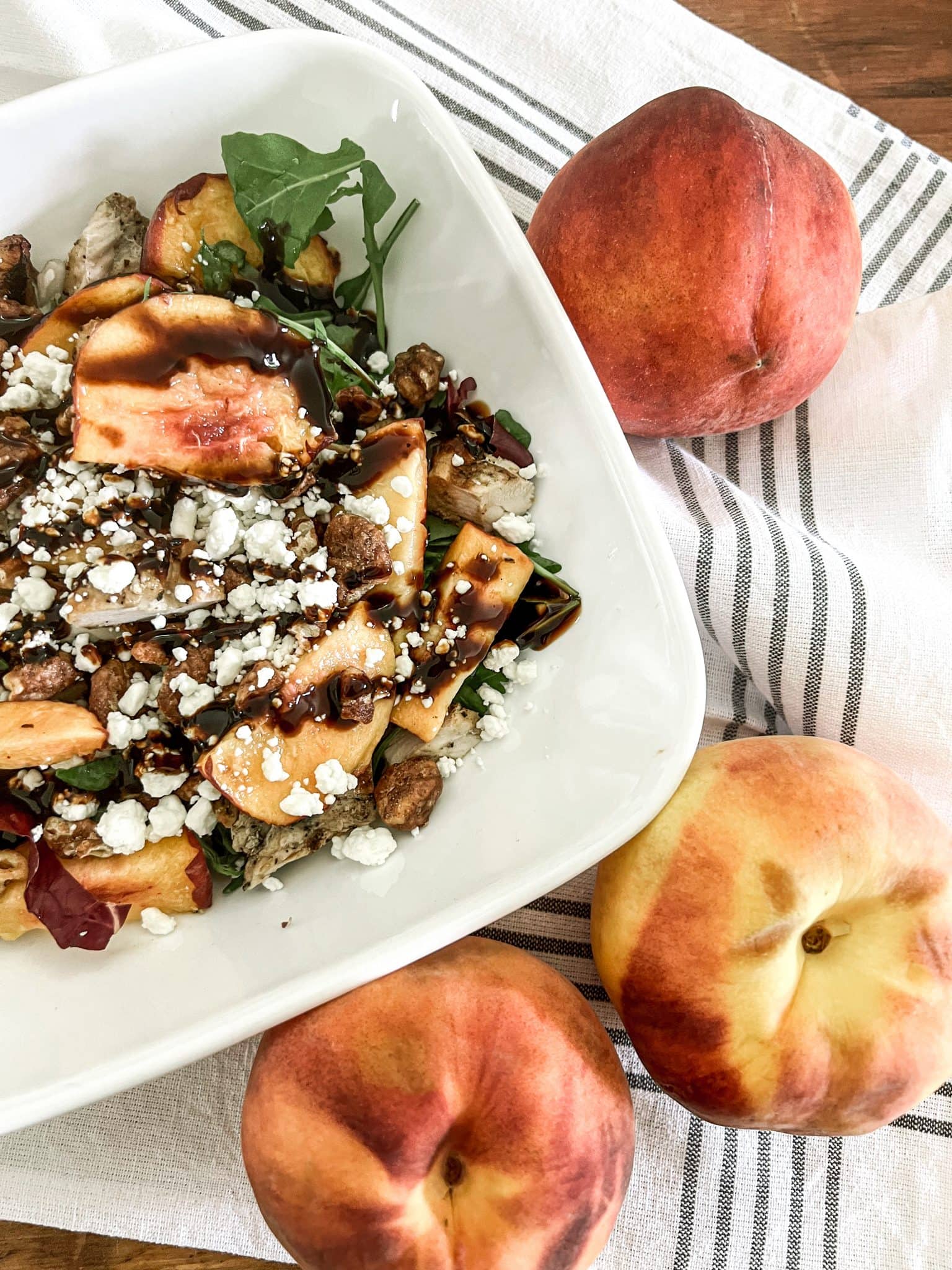 tuesday turn about 205 summer salads peach arugala salad in bowl with peaches on table