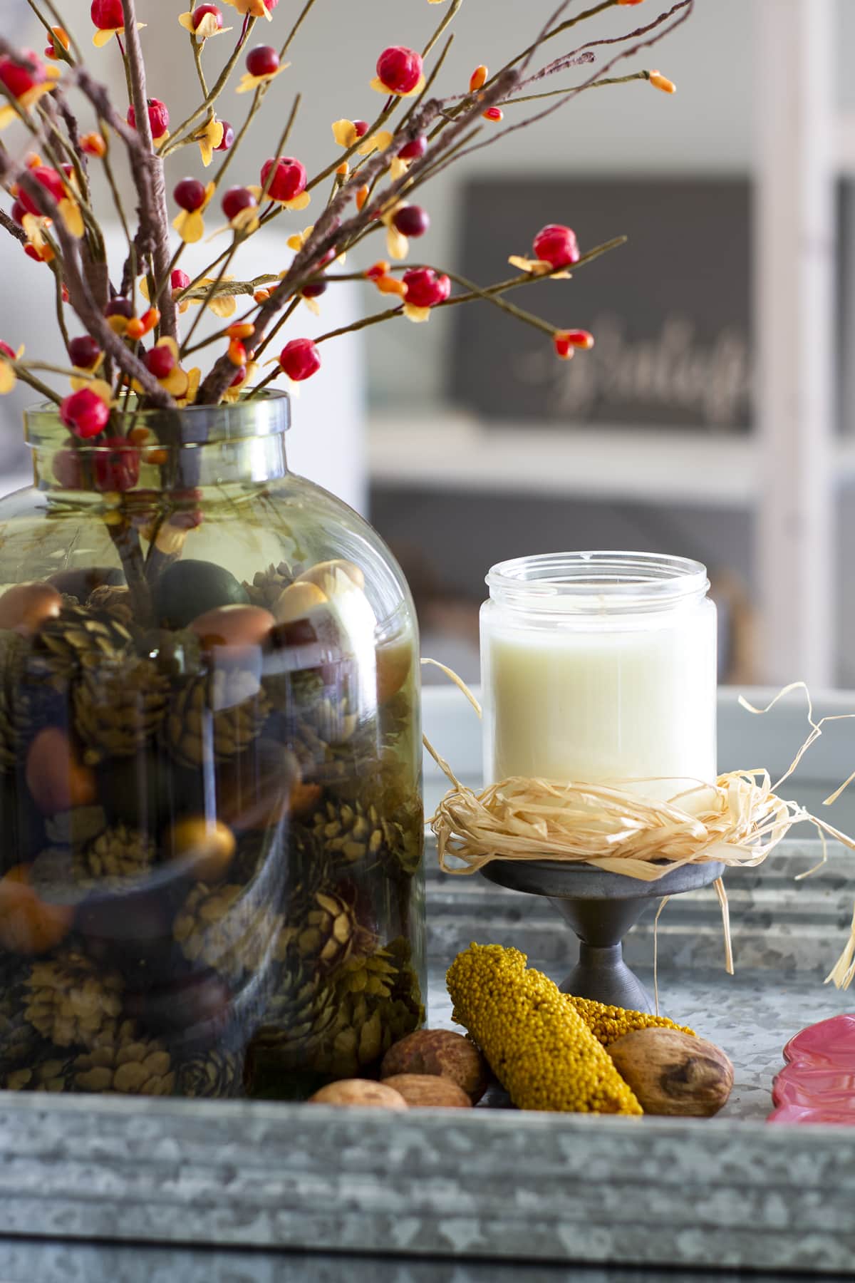 early fall vignette for a small coffee table fall vignette on metal tray with candle leaf tray and fall elements