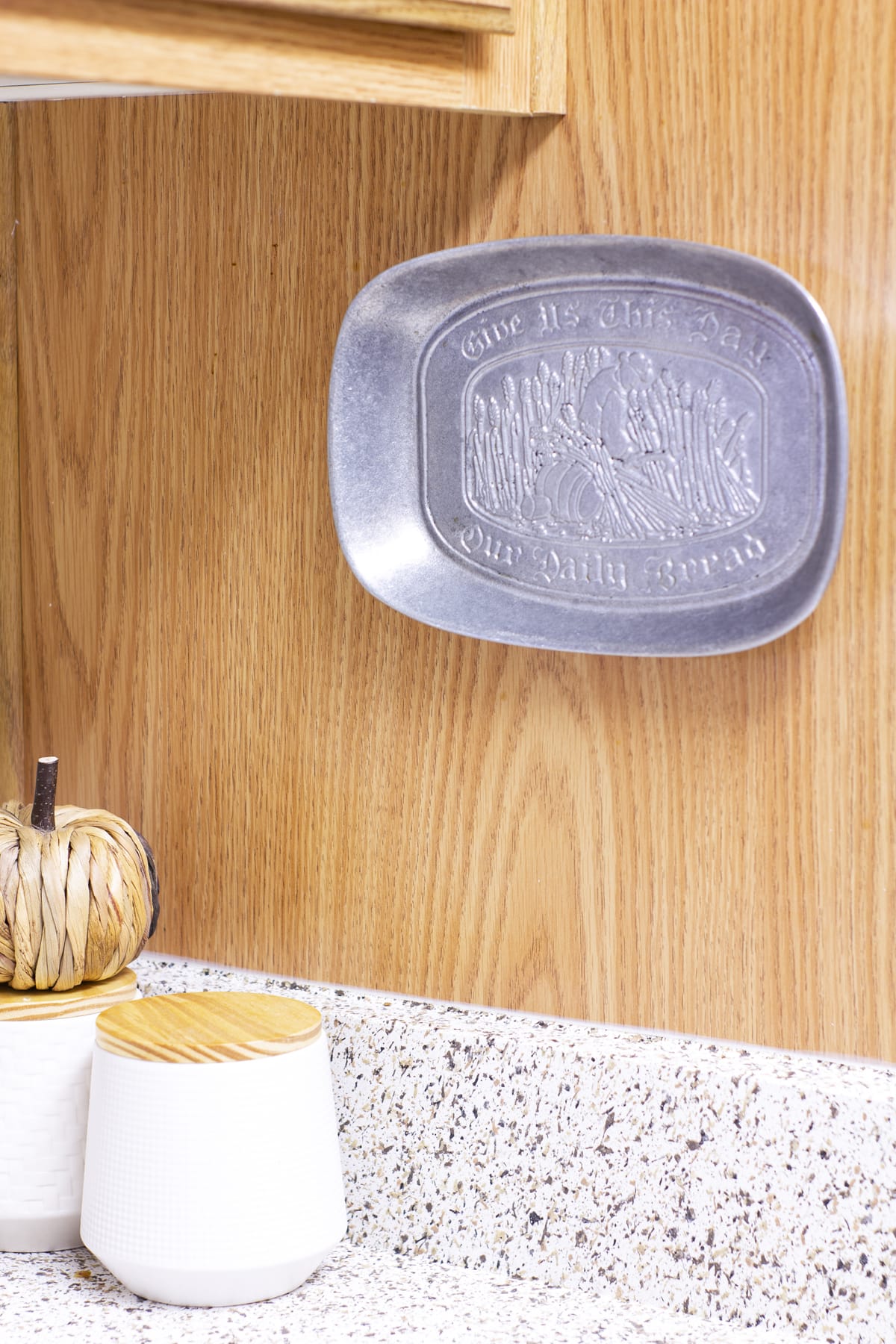 fall decor ideas for a cozy apartment kitchen and entryway pewter tray on side of cabinet