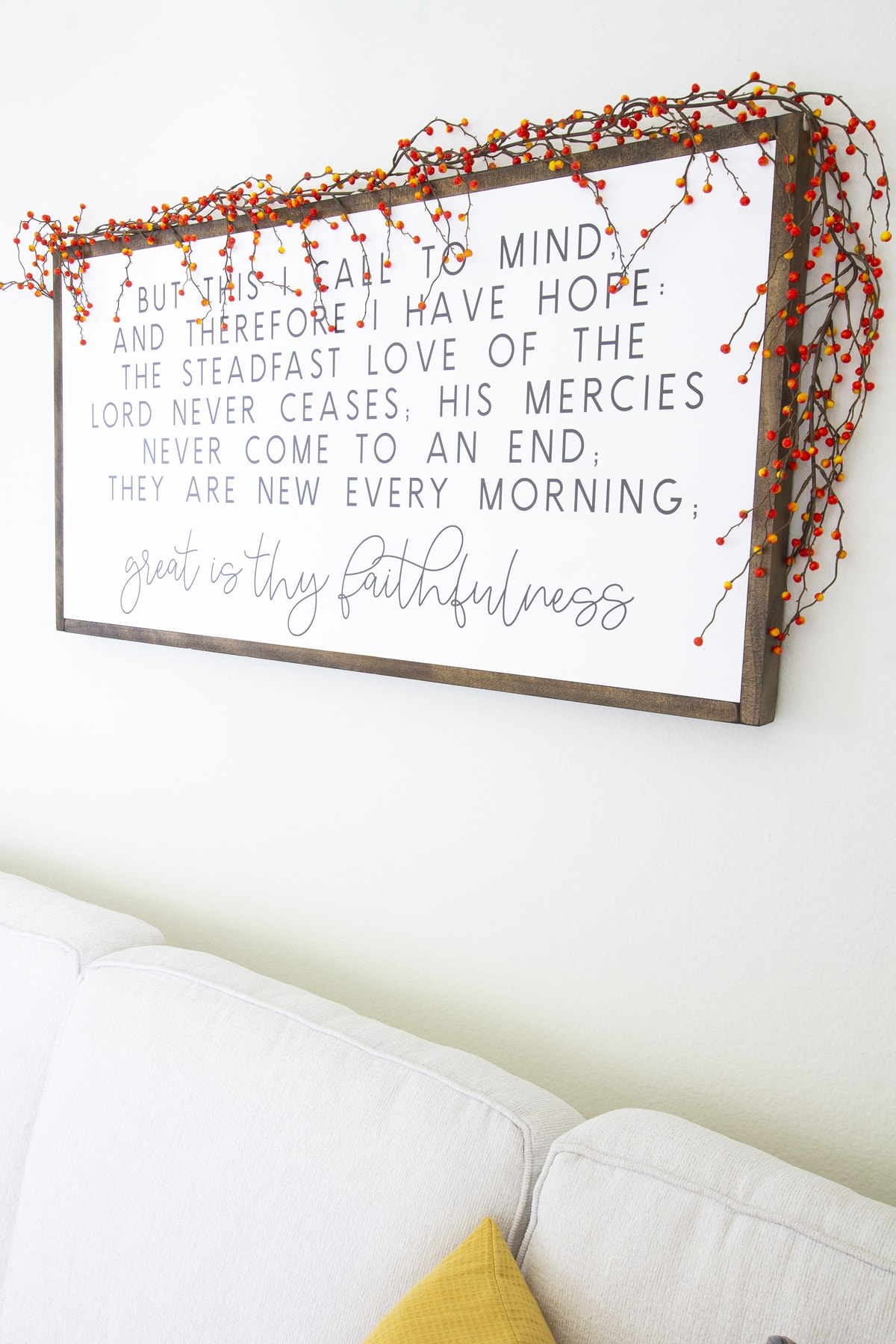 how to decorate your cozy apartment with fall faux florals lettered sign with berry garland surround