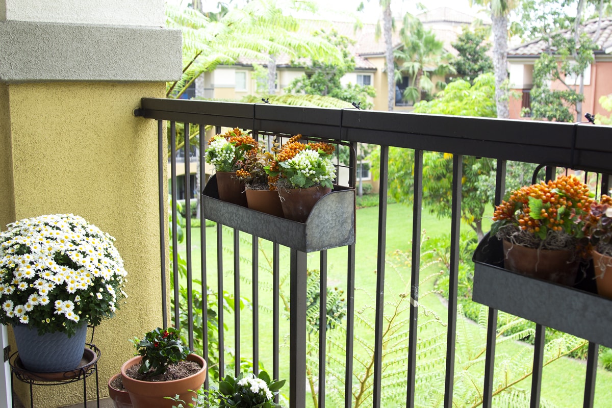 balcony rails with window boxes and faux florals