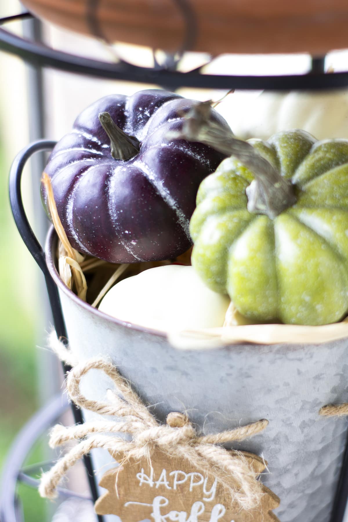 how to decorate your cozy apartment with fall faux florals pumpkins in metal bucket