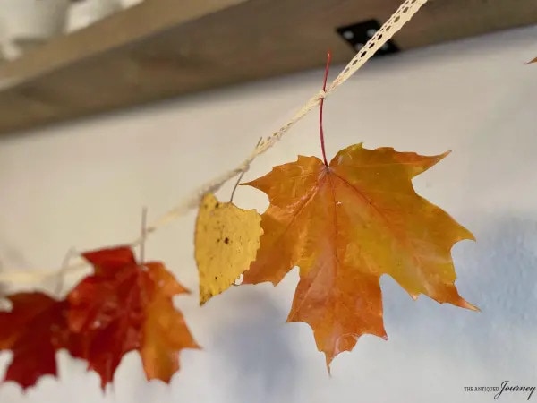 fall leaf garland strung across mantel