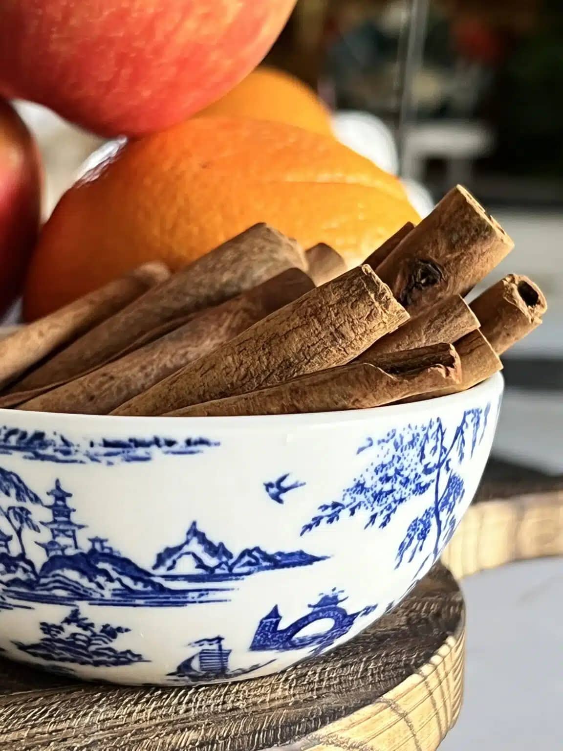 fall fruits and spices in blue and white bowl