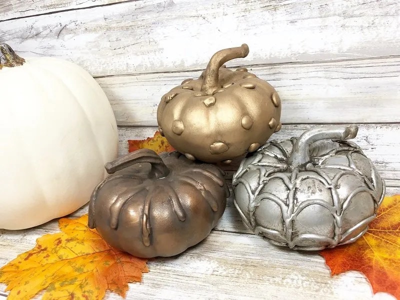 tuesday turn about 225 autumn finds steam punk pumpkins on wood surface and fall leaves