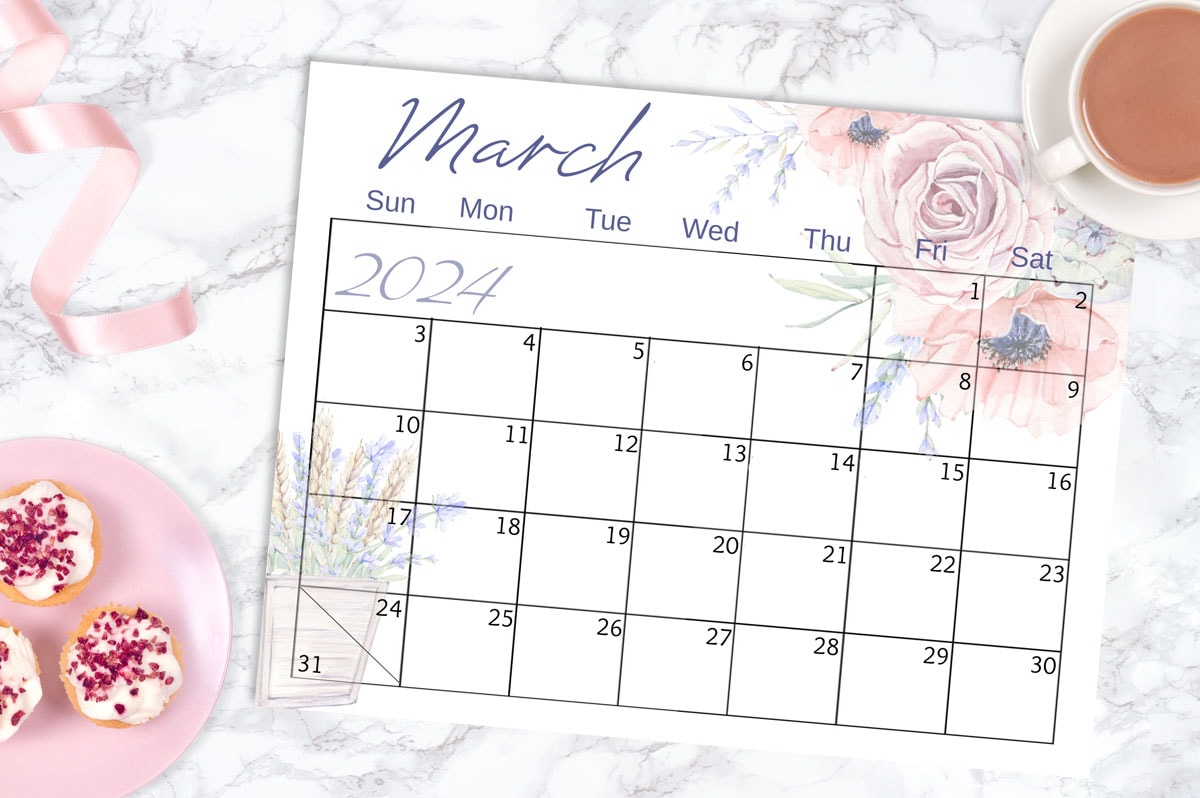 march calendar page on marble surface with spring elements