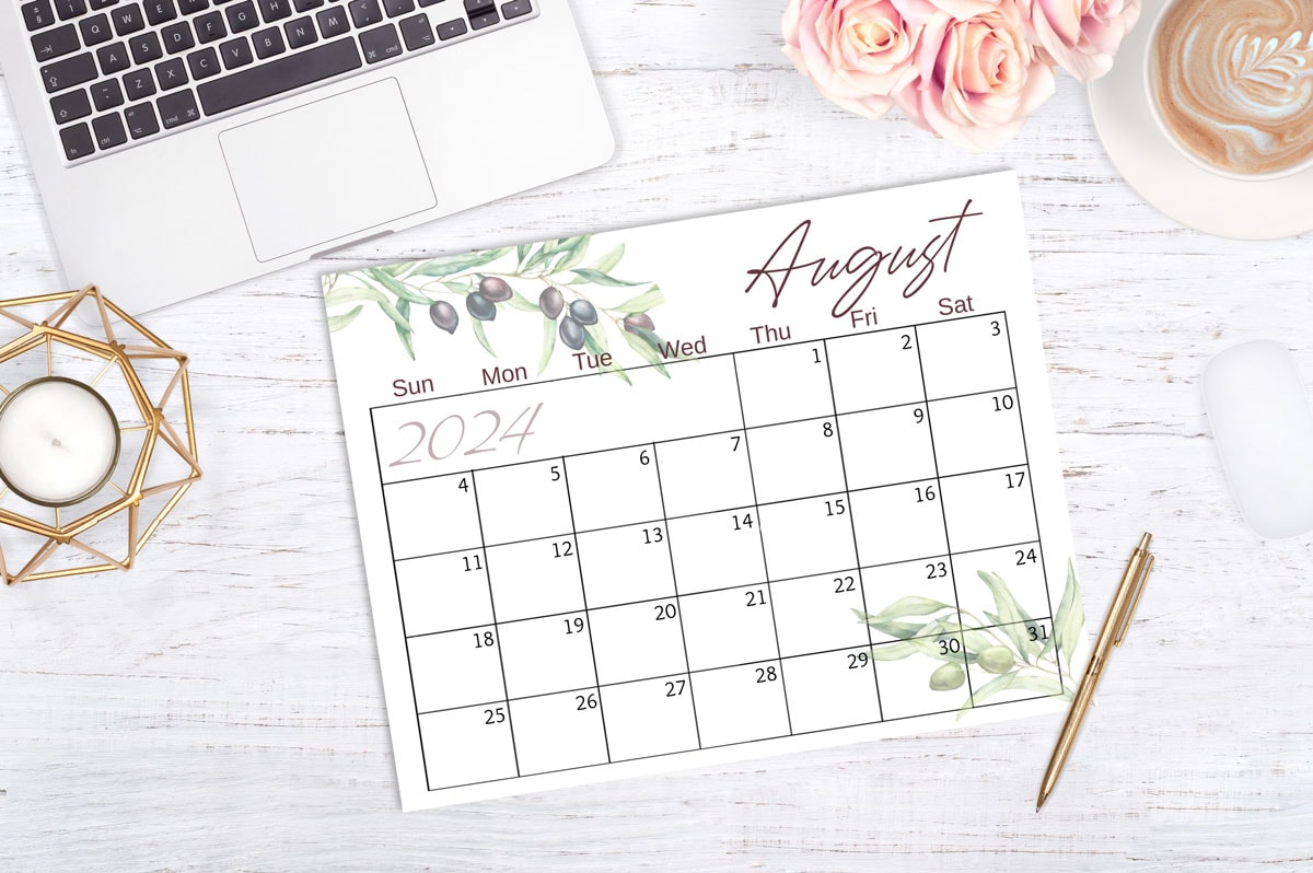 free 2024 printable watercolor calendar august page with olives on desk with office items