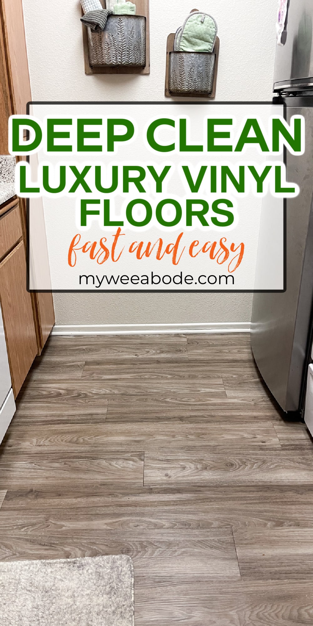 galley kitchen with luxury vinyl plank floors
