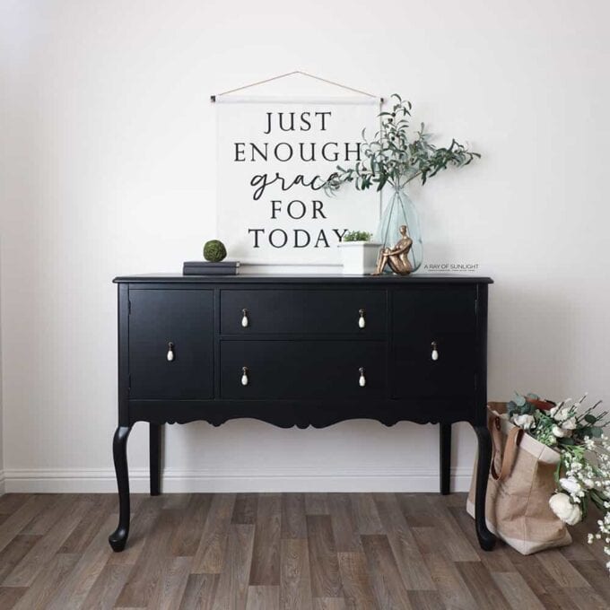 black buffet with white hardware and farmhouse decor