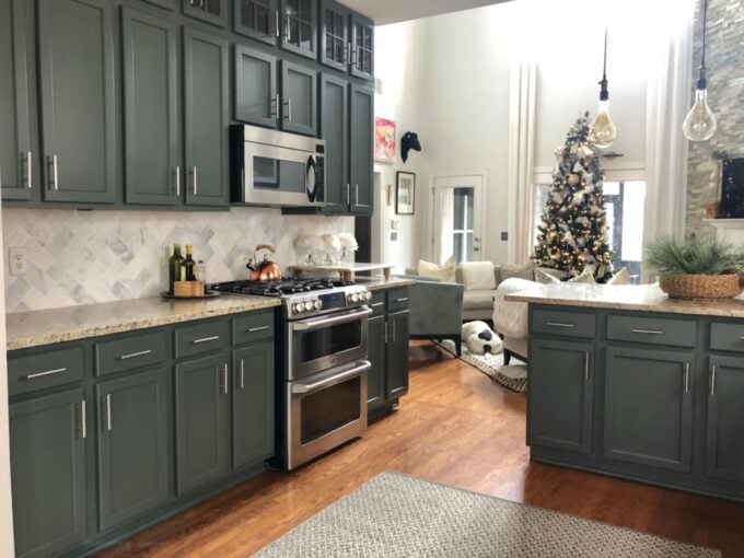 sage green cabinet paint colors dark sage green cabinets with white backsplash and wood accents
