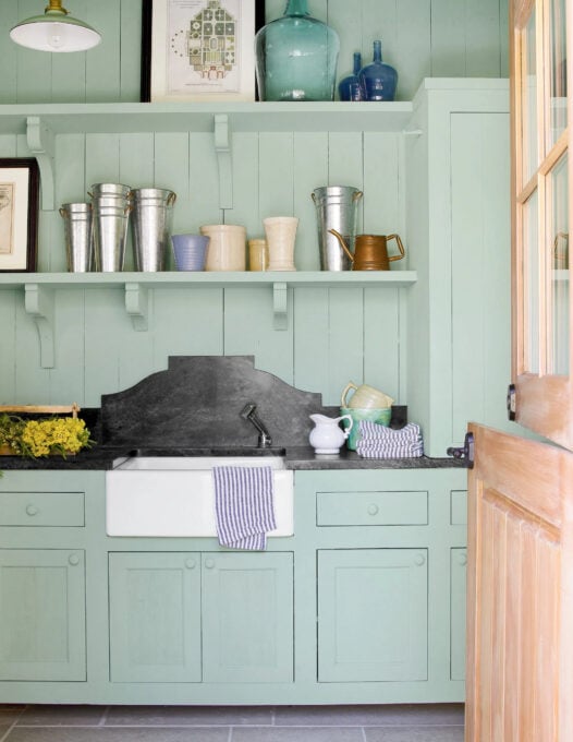 sage green cabinet paint colors potting bench with planting tools and pots